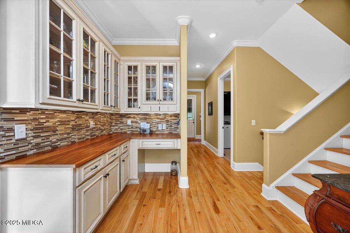 208 Crystal Drive Byron, GA 31008 - Photo 33 of 87 a kitchen with stainless steel appliances granite countertop a stove and a wooden floors
