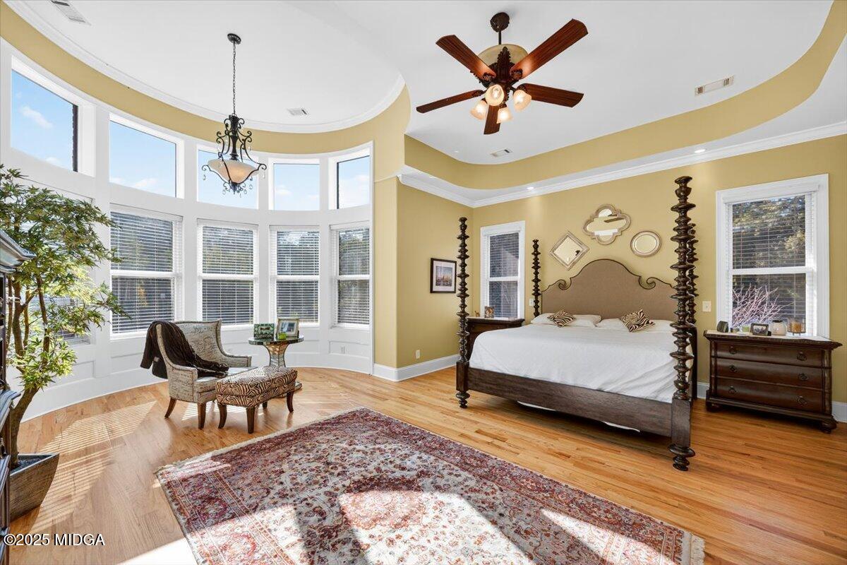 208 Crystal Drive Byron, GA 31008 - Photo 36 of 87 a bedroom with a bed and wooden floor