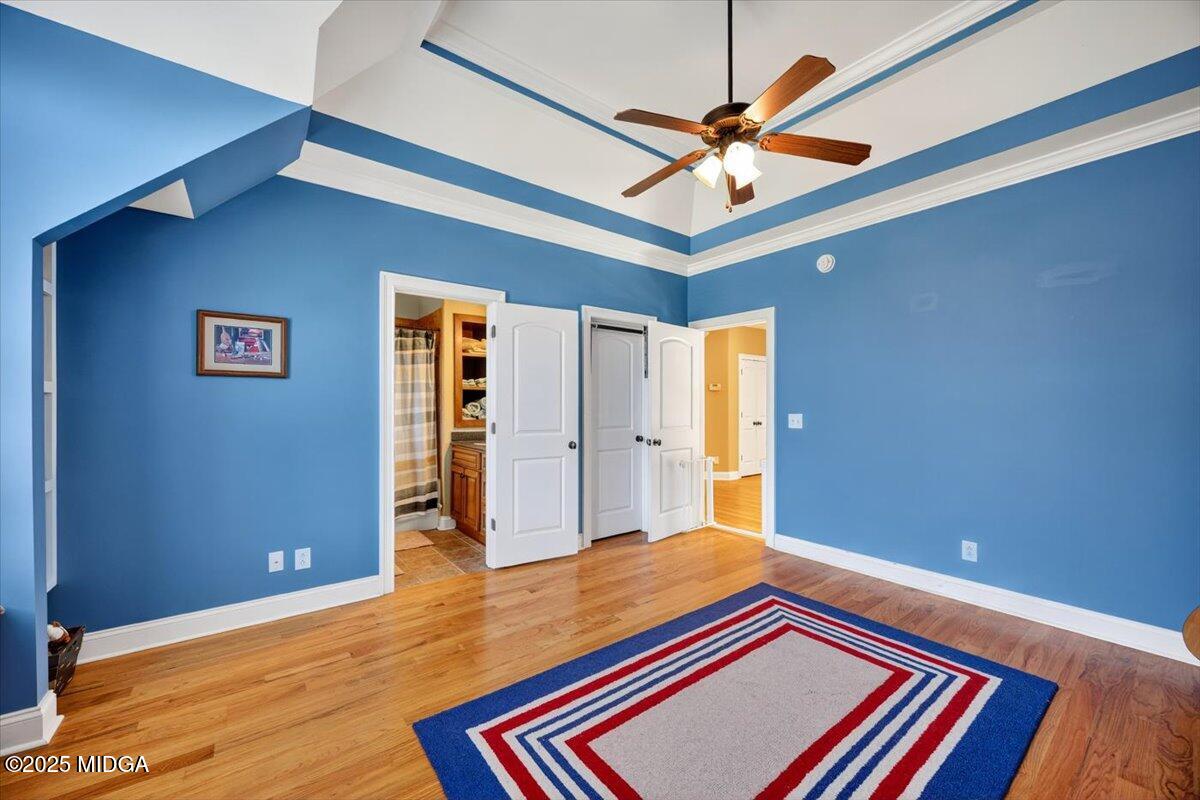 208 Crystal Drive Byron, GA 31008 - Photo 51 of 87 a bedroom with a bed and a ceiling fan