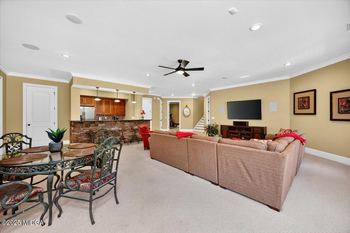 208 Crystal Drive Byron, GA 31008 - Photo 61 of 87 a living room with furniture and a flat screen tv