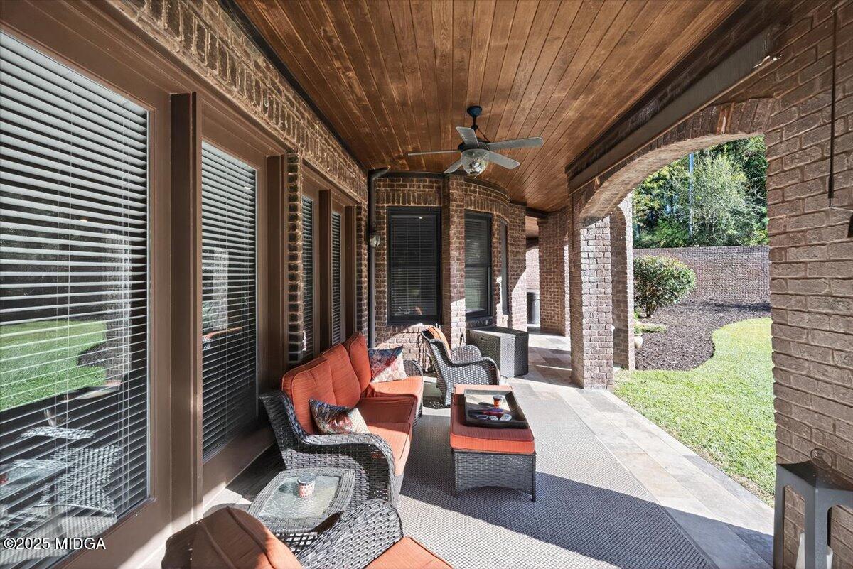 208 Crystal Drive Byron, GA 31008 - Photo 67 of 87 a outdoor space with patio the couches and pool table with chairs