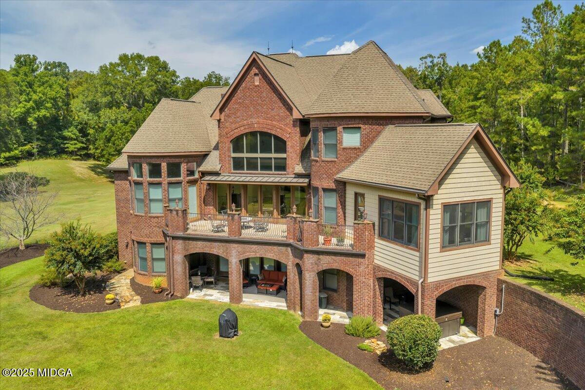 208 Crystal Drive Byron, GA 31008 - Photo 7 of 87 a front view of a house with a yard table and chairs