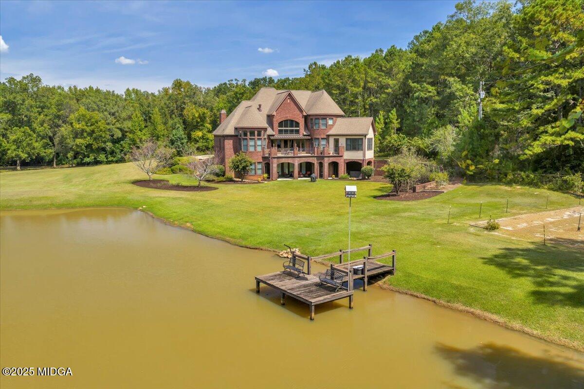 208 Crystal Drive Byron, GA 31008 - Photo 72 of 87 a view of a swimming pool with lawn chairs and a yard