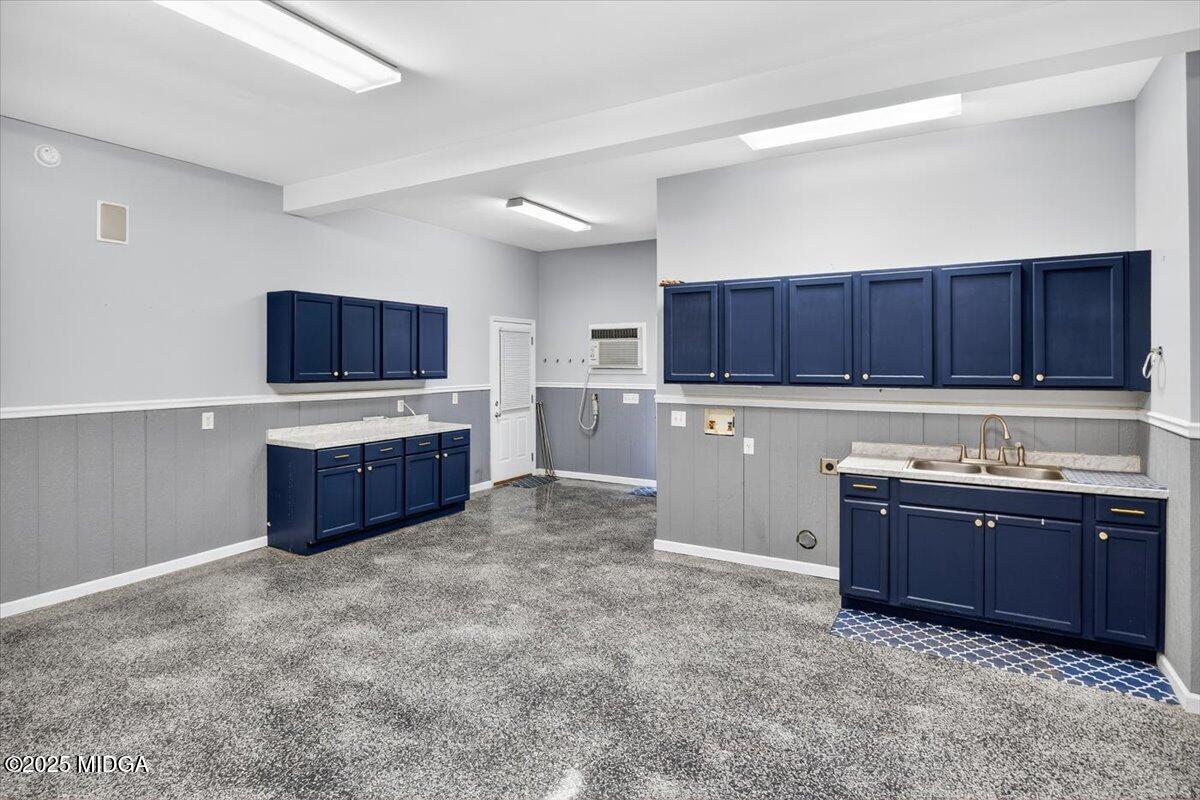 208 Crystal Drive Byron, GA 31008 - Photo 80 of 87 a kitchen with wooden cabinets and white appliances