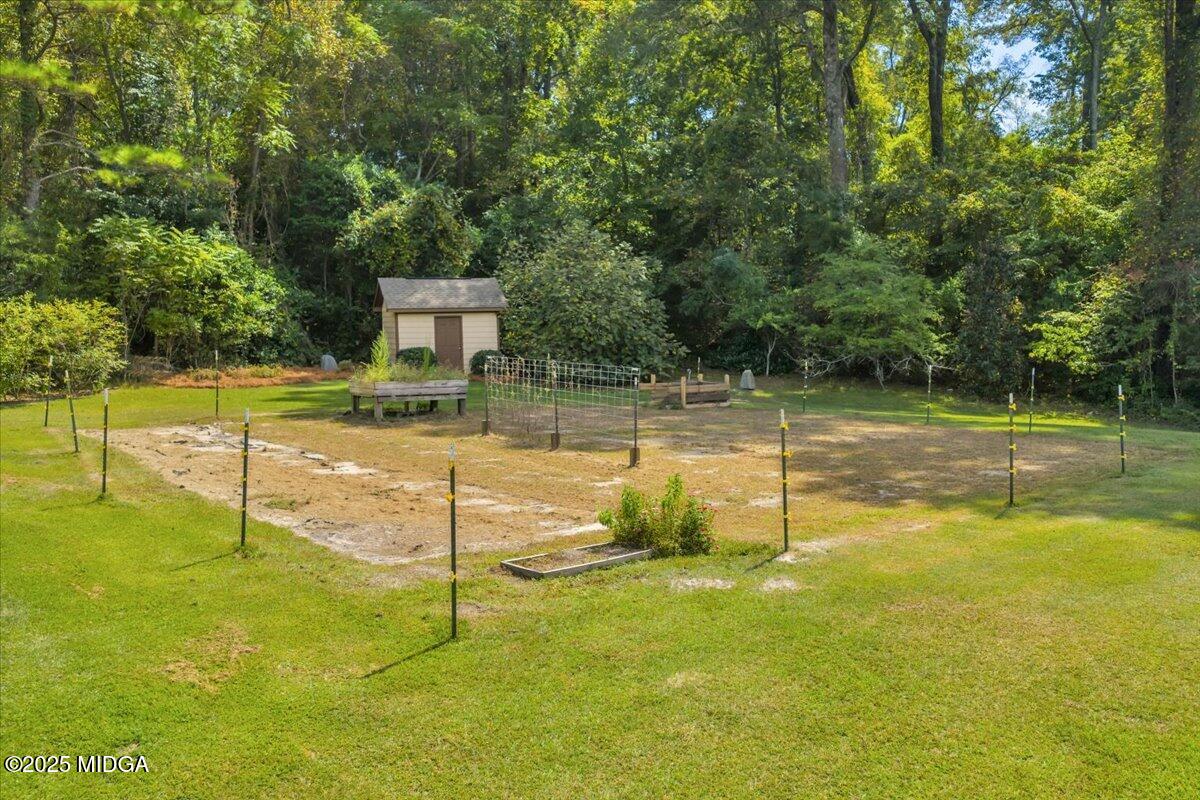 208 Crystal Drive Byron, GA 31008 - Photo 85 of 87 a view of a swimming pool with a yard