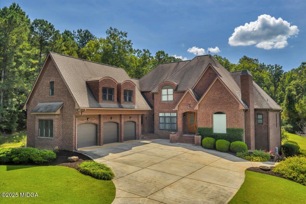 208 Crystal Drive Byron, GA 31008 - Photo 9 of 87 a front view of a house with a yard and potted plants