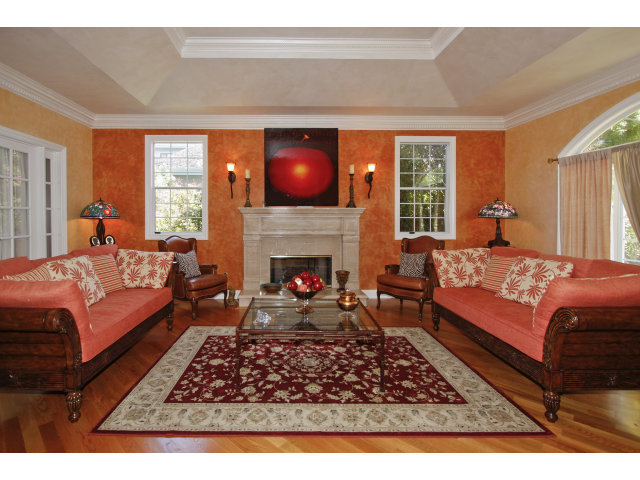 9 Ashdown Place Half Moon Bay, CA 94019 - Photo 4 of 21 a living room with furniture a rug and a fireplace