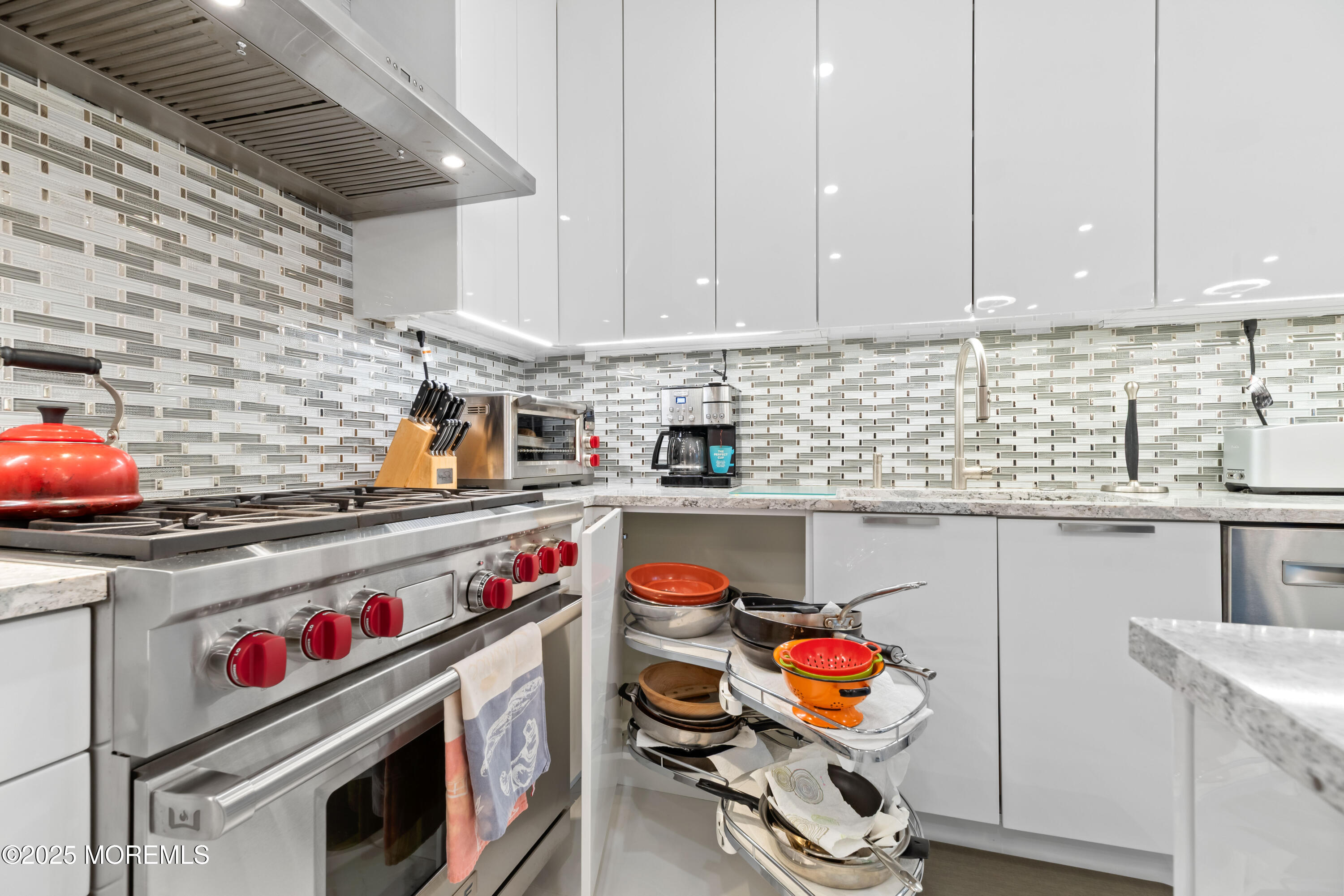 17 Riviera Drive Long Branch, NJ 07740 - Photo 15 of 52 a utility room with stainless steel appliances granite countertop a stove and a sink