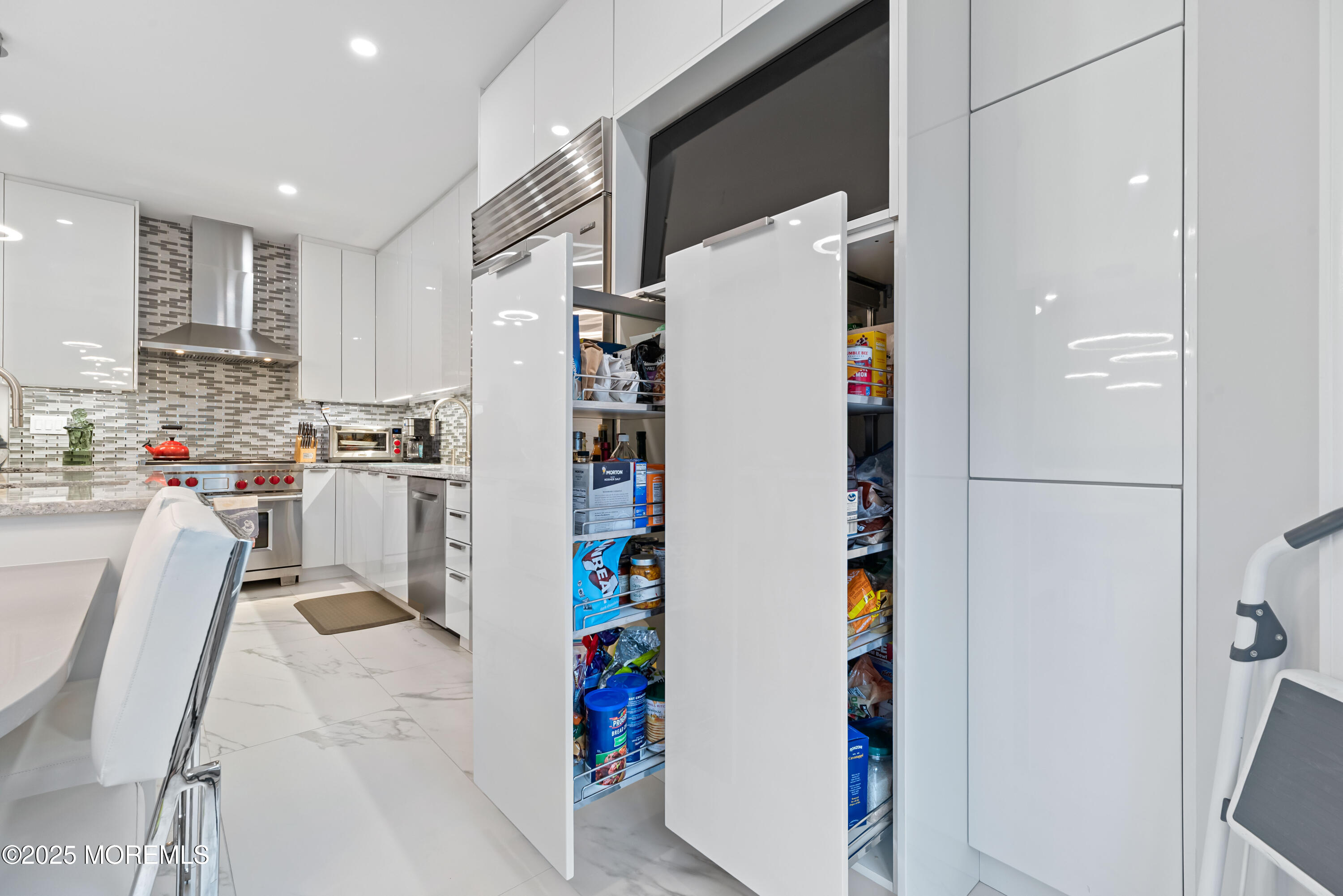 17 Riviera Drive Long Branch, NJ 07740 - Photo 17 of 52 a kitchen with refrigerator and cabinets