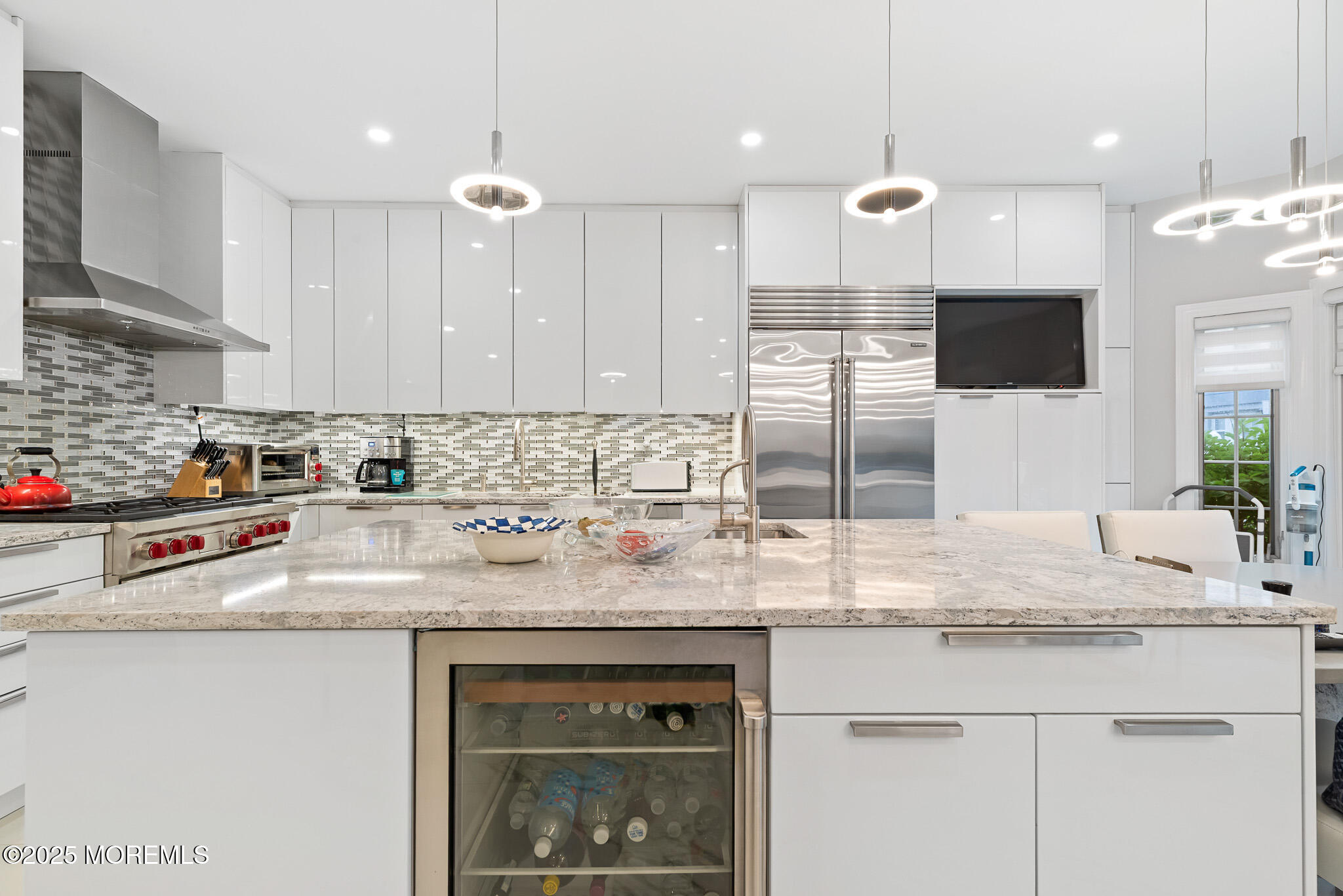17 Riviera Drive Long Branch, NJ 07740 - Photo 18 of 52 a kitchen with kitchen island granite countertop a sink cabinets and stainless steel appliances