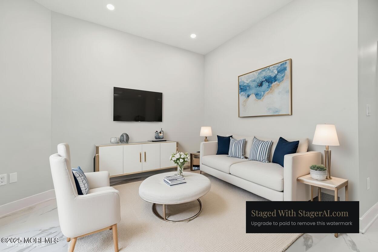 17 Riviera Drive Long Branch, NJ 07740 - Photo 20 of 52 a living room with furniture and a flat screen tv