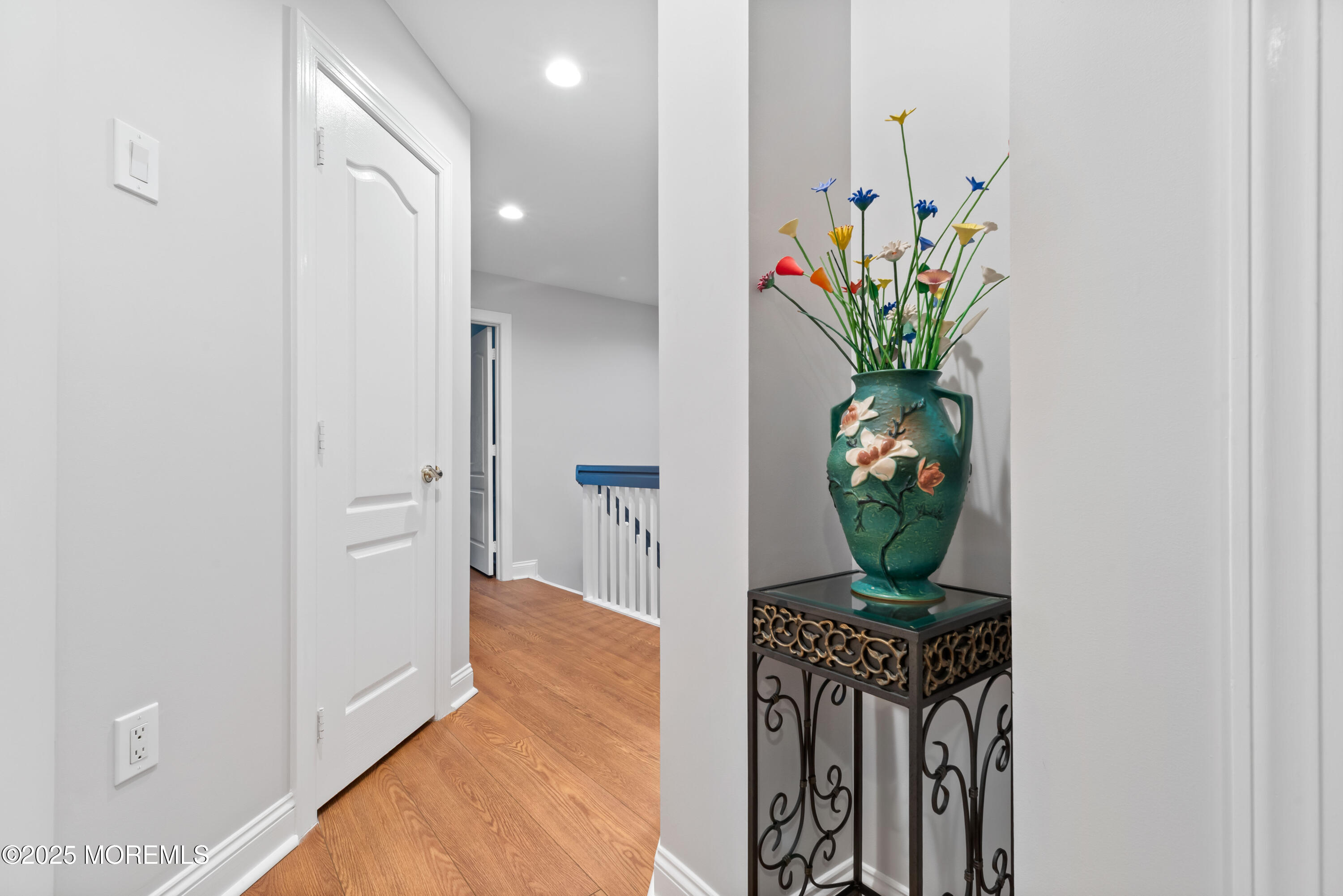 17 Riviera Drive Long Branch, NJ 07740 - Photo 26 of 52 a vase of flowers sitting on a table in a hall