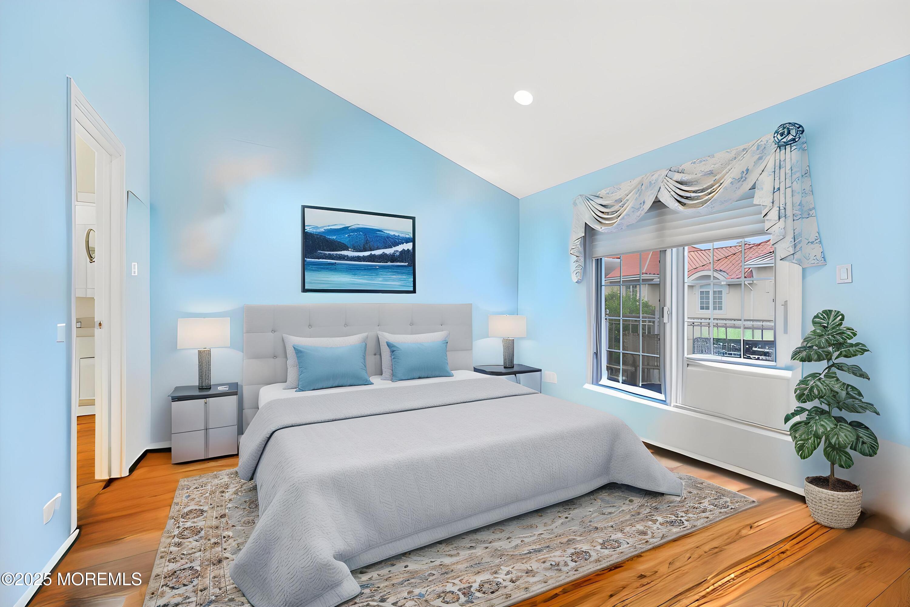 17 Riviera Drive Long Branch, NJ 07740 - Photo 29 of 52 a bedroom with a large bed and a painting on the wall