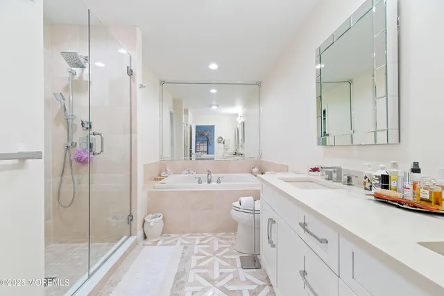 a bedroom with bed and a couch