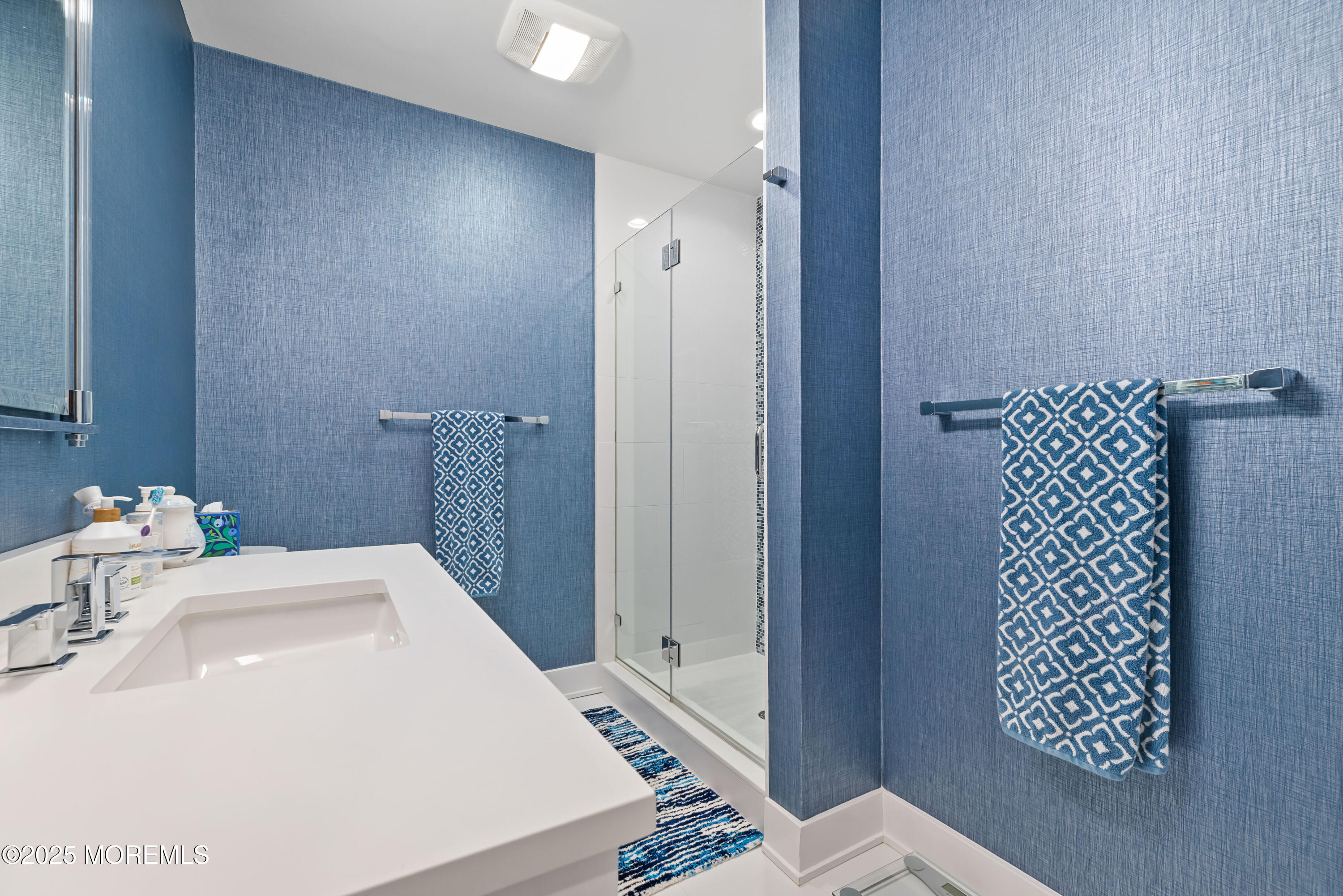 17 Riviera Drive Long Branch, NJ 07740 - Photo 36 of 52 a bathroom with a sink and a mirror