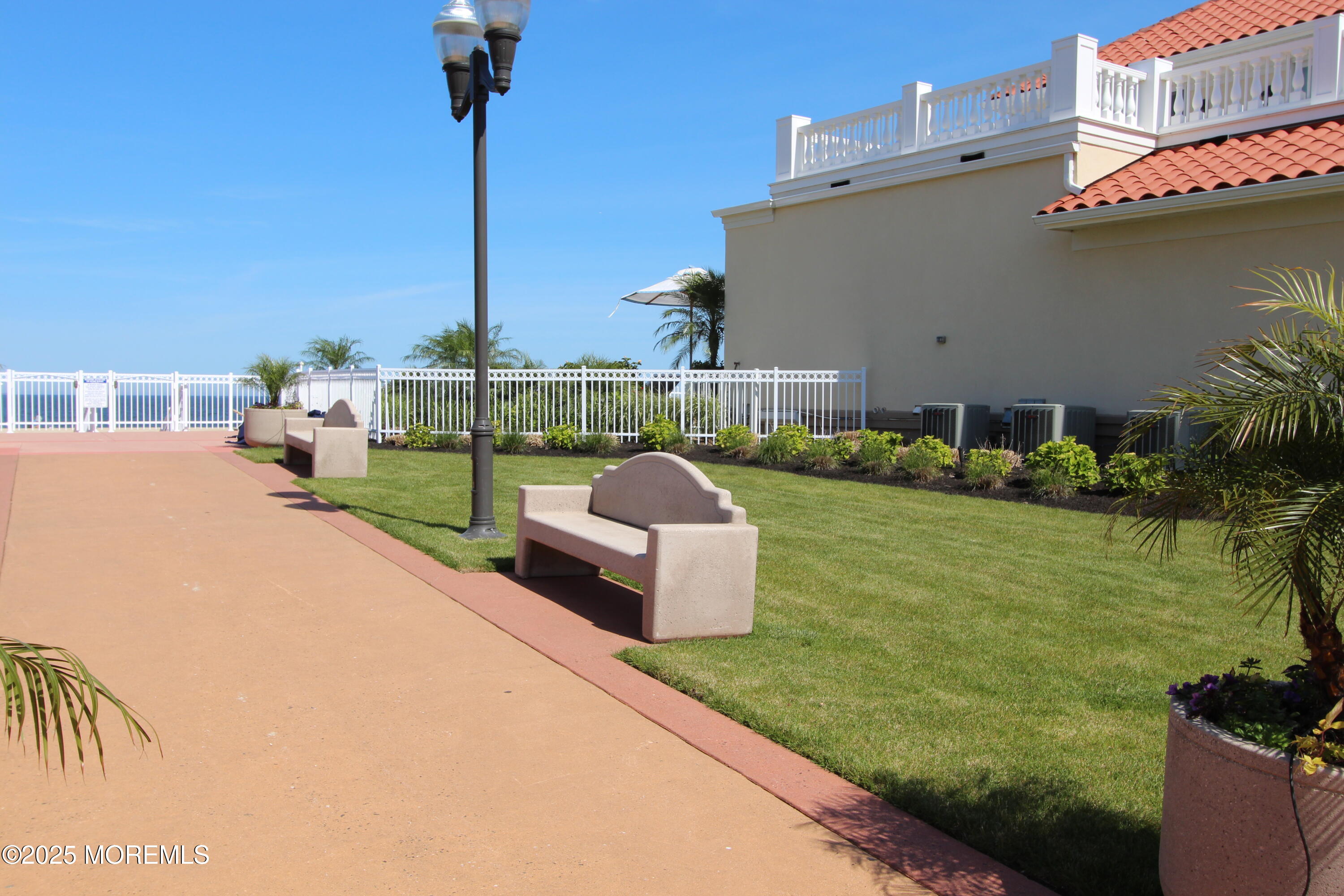 17 Riviera Drive Long Branch, NJ 07740 - Photo 40 of 52 a front view of a house with a garden and lake view