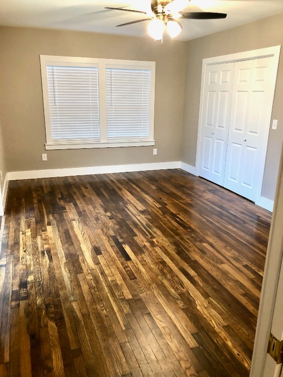 1221 South Austin Avenue Georgetown, TX 78626 - Photo 11 of 19 a view of a room with wooden floor and windows
