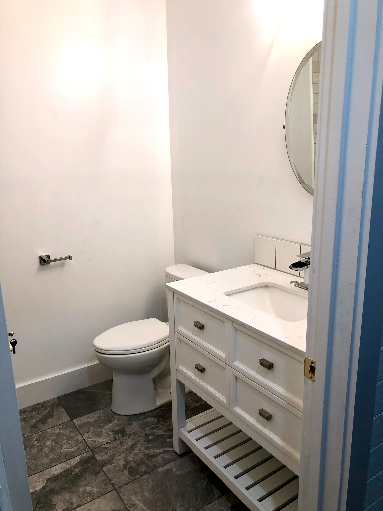 1221 South Austin Avenue Georgetown, TX 78626 - Photo 12 of 19 a bathroom with a granite countertop toilet and a sink