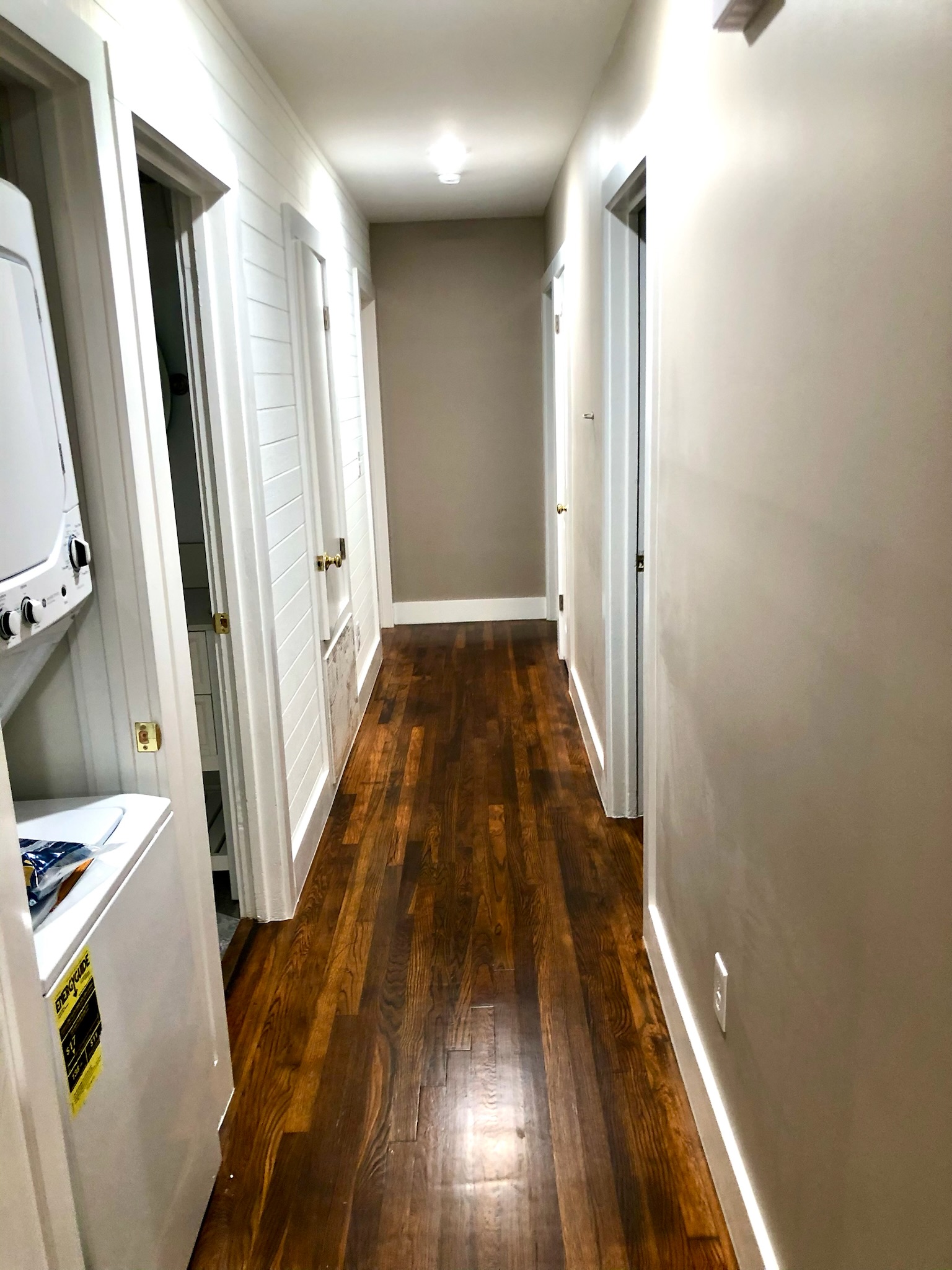 1221 South Austin Avenue Georgetown, TX 78626 - Photo 13 of 19 a view of a hallway with wooden floor