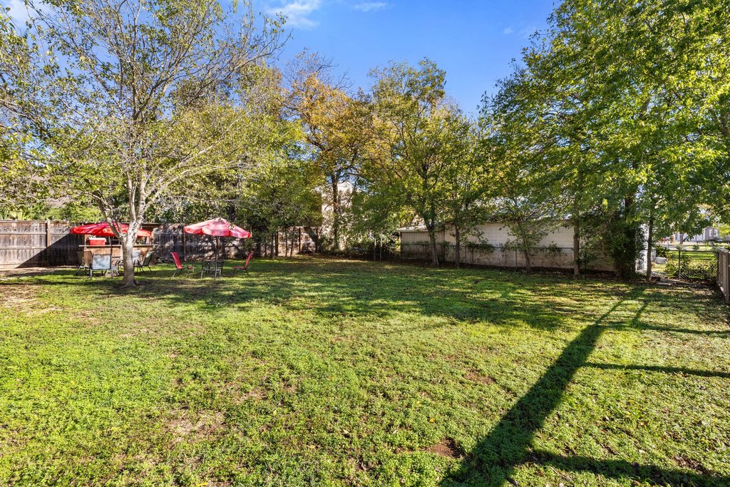 1221 South Austin Avenue Georgetown, TX 78626 - Photo 18 of 19 a view of swimming pool with a garden