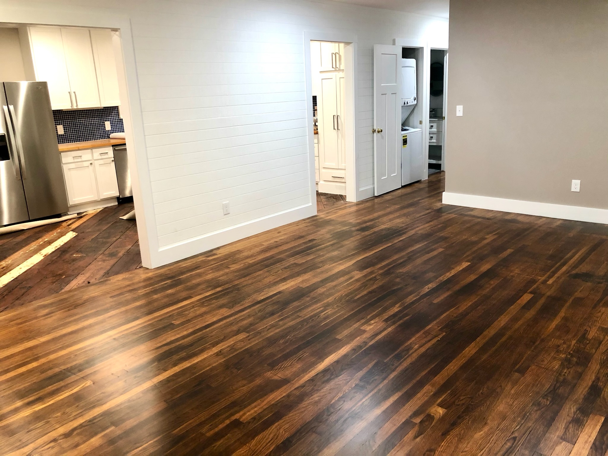 1221 South Austin Avenue Georgetown, TX 78626 - Photo 2 of 19 an empty room with wooden floor and windows