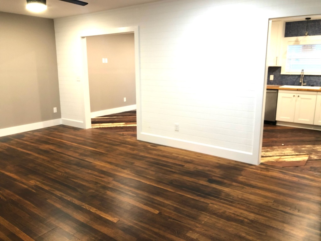 1221 South Austin Avenue Georgetown, TX 78626 - Photo 3 of 19 a view of a room with wooden floor