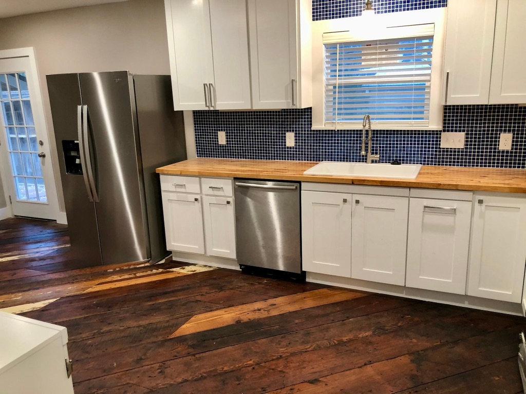 1221 South Austin Avenue Georgetown, TX 78626 - Photo 4 of 19 a kitchen with a sink cabinets and stainless steel appliances