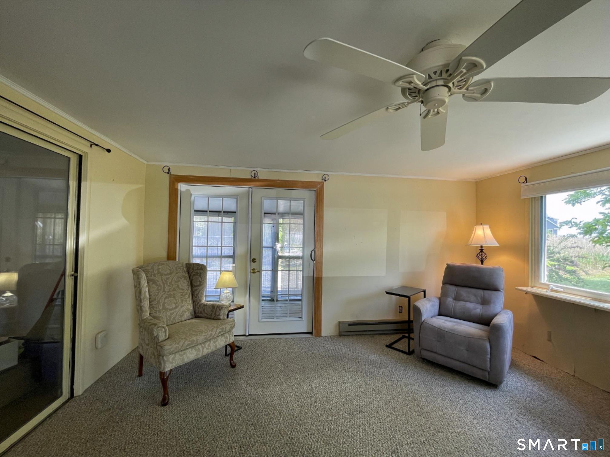 18 Old South Cove Road Old Saybrook, CT 06475 - Photo 12 of 40 a living room with furniture and a window
