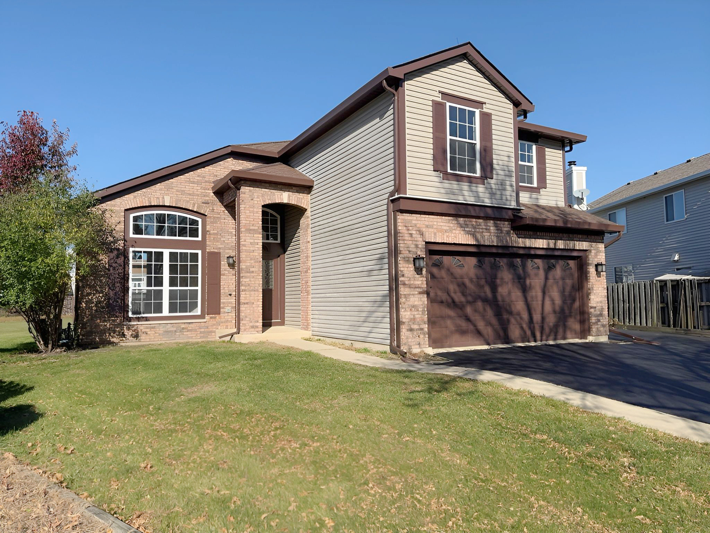 1183 Moonstone Run Lake In The Hills, IL 60156 - Photo 1 of 41 a front view of a house with a yard