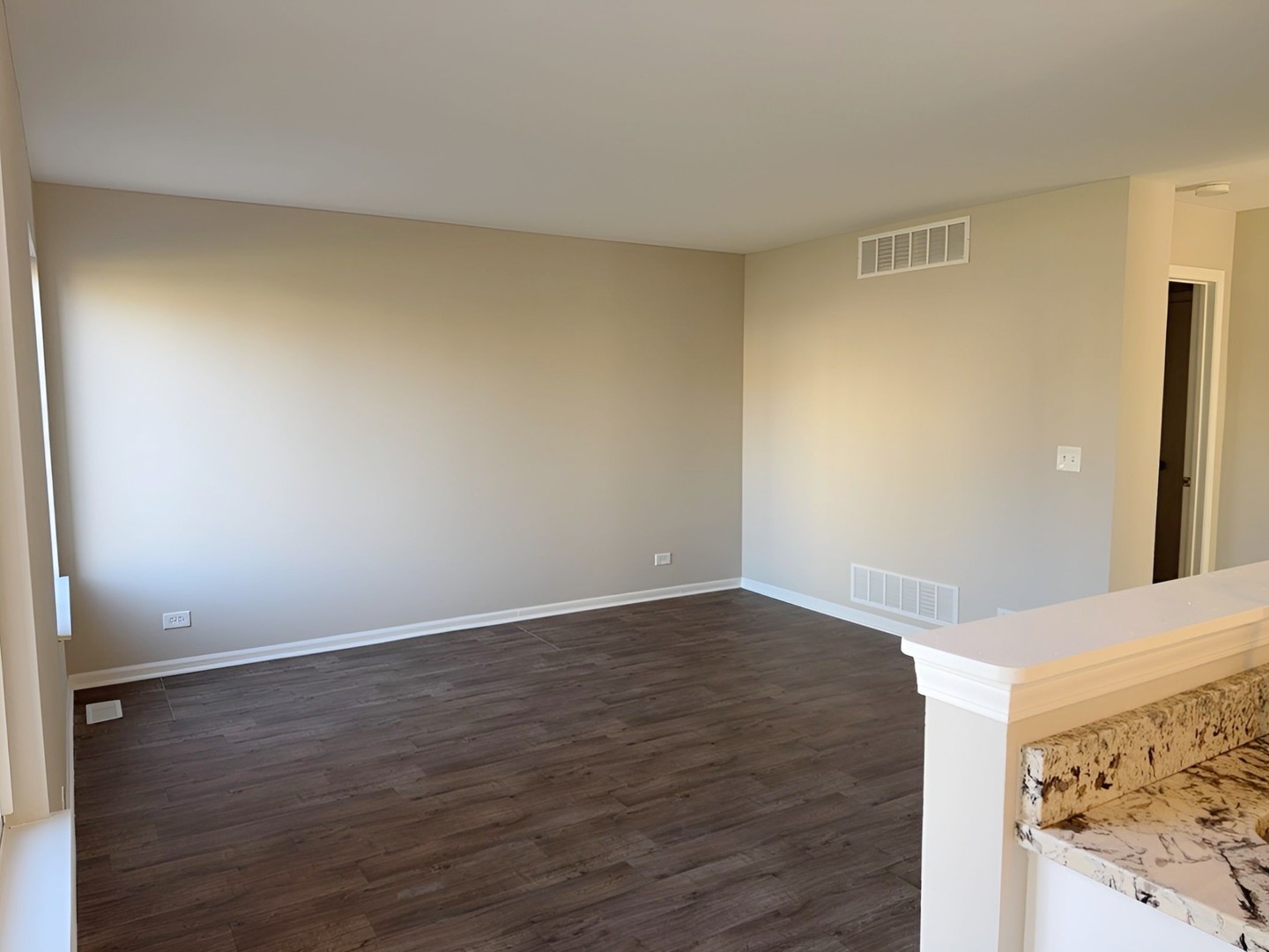 1183 Moonstone Run Lake In The Hills, IL 60156 - Photo 16 of 41 a view of an empty room and wooden floor