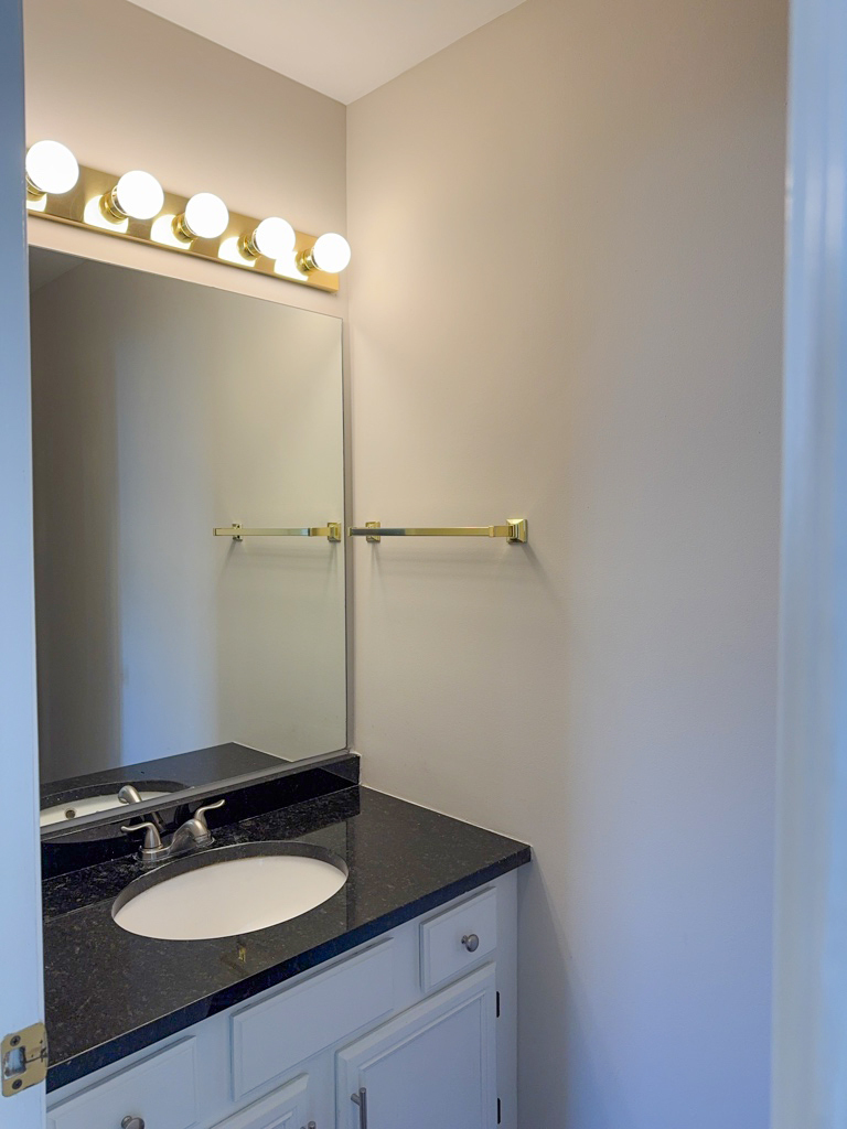 1183 Moonstone Run Lake In The Hills, IL 60156 - Photo 20 of 41 a bathroom with a granite countertop sink and a mirror