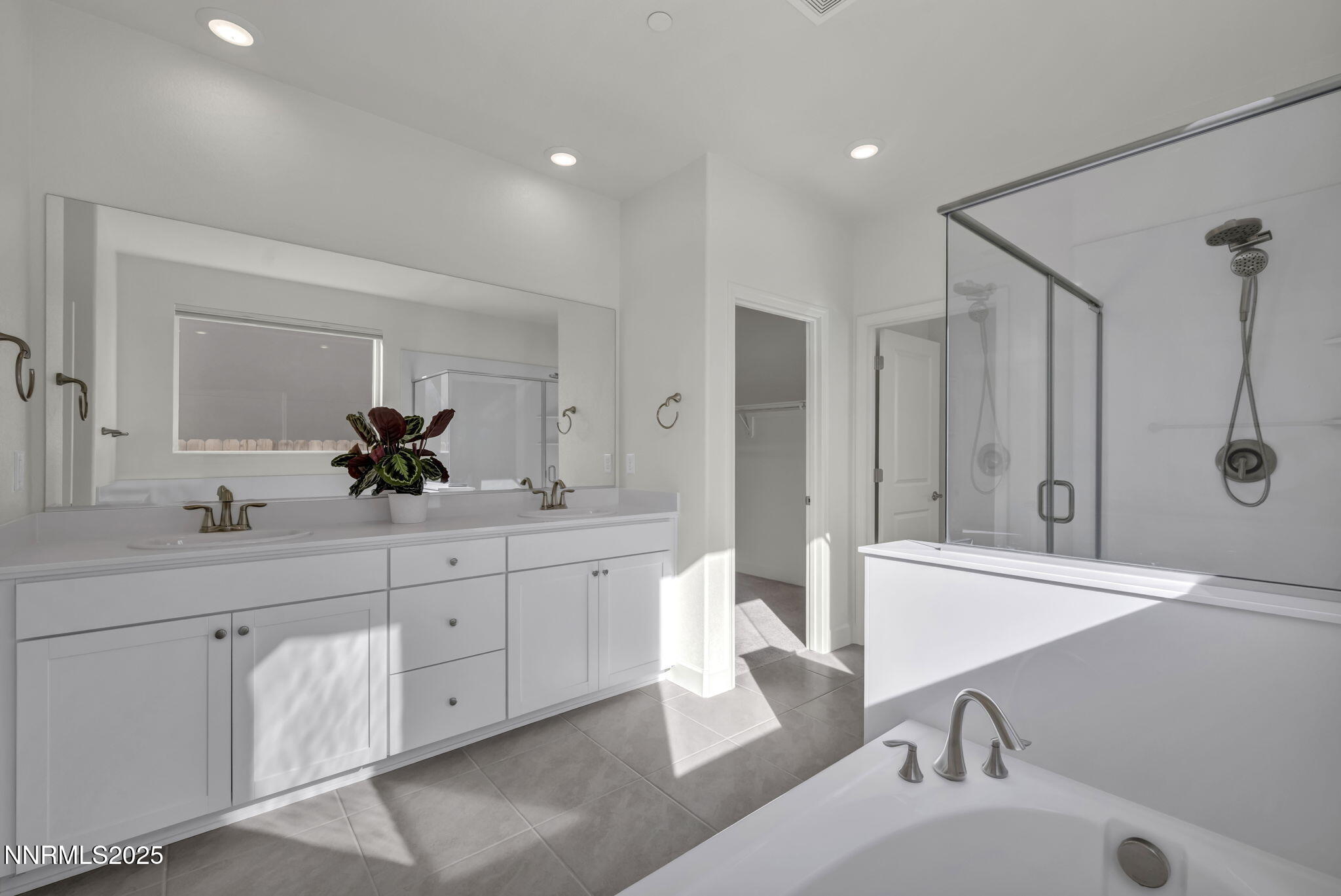 6870 Pilot Peak Road Sparks, NV 89436 - Photo 15 of 55 a spacious bathroom with a double vanity sink mirror and double