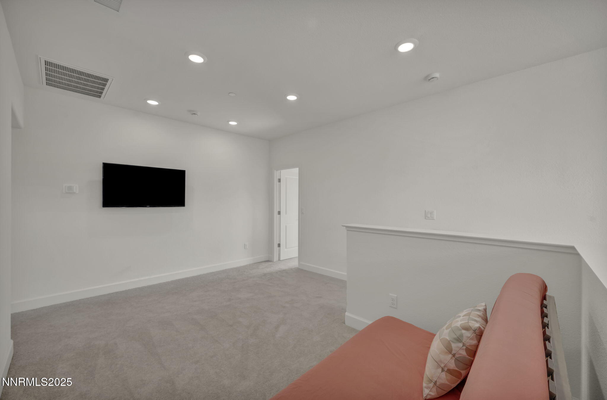 6870 Pilot Peak Road Sparks, NV 89436 - Photo 32 of 55 a living room with furniture and a flat screen tv