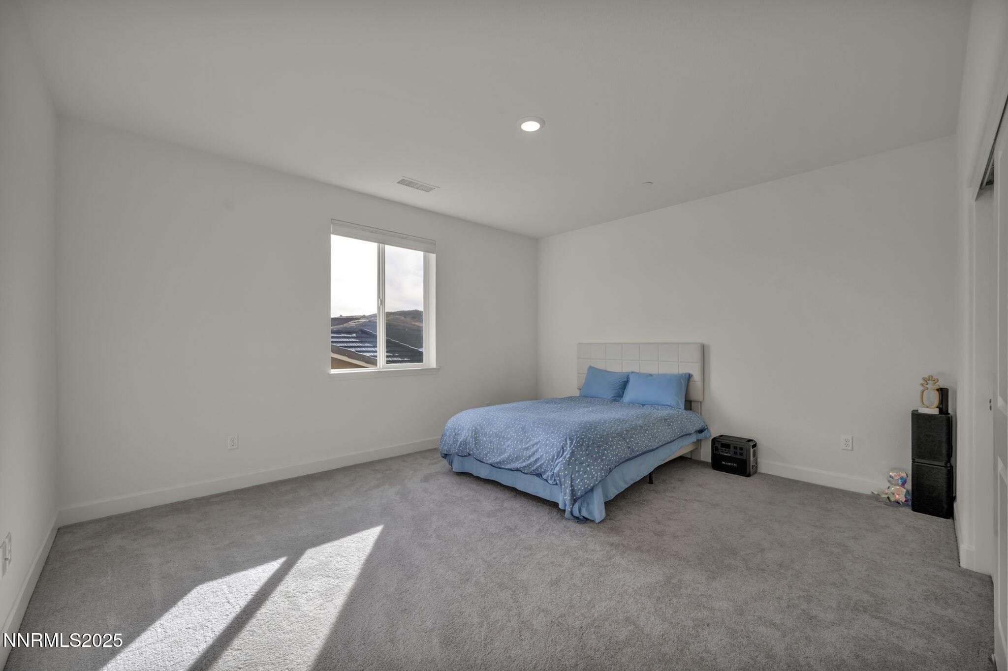 6870 Pilot Peak Road Sparks, NV 89436 - Photo 34 of 55 a bedroom with a bed and a window