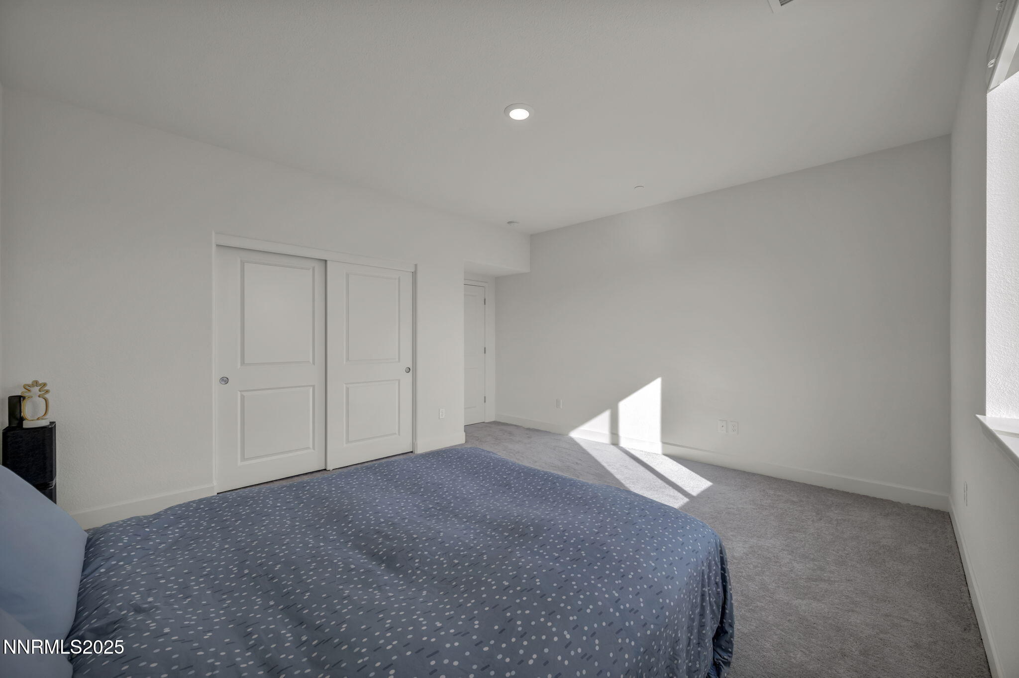 6870 Pilot Peak Road Sparks, NV 89436 - Photo 35 of 55 a bedroom with a bed and a window