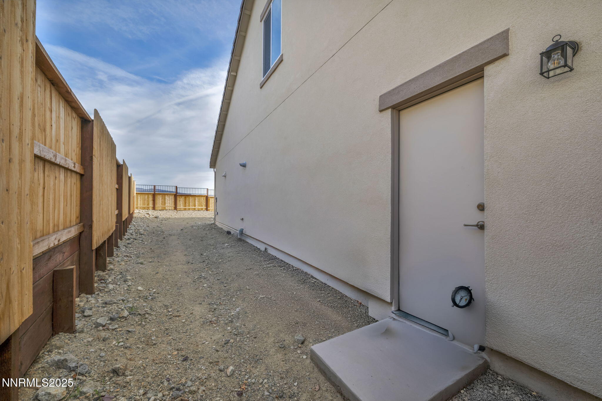 6870 Pilot Peak Road Sparks, NV 89436 - Photo 46 of 55 a view of an empty room with wooden floor and a window