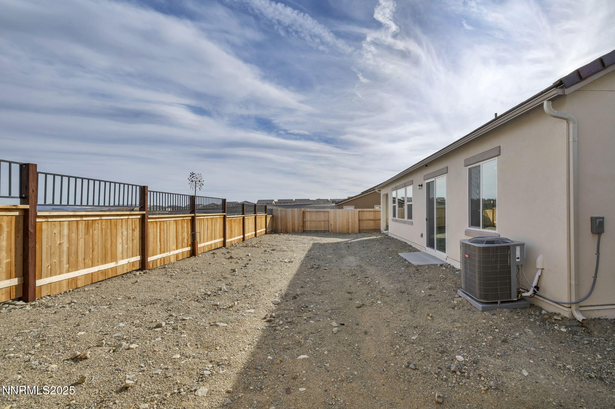 6870 Pilot Peak Road Sparks, NV 89436 - Photo 47 of 55 a view of a house with a backyard
