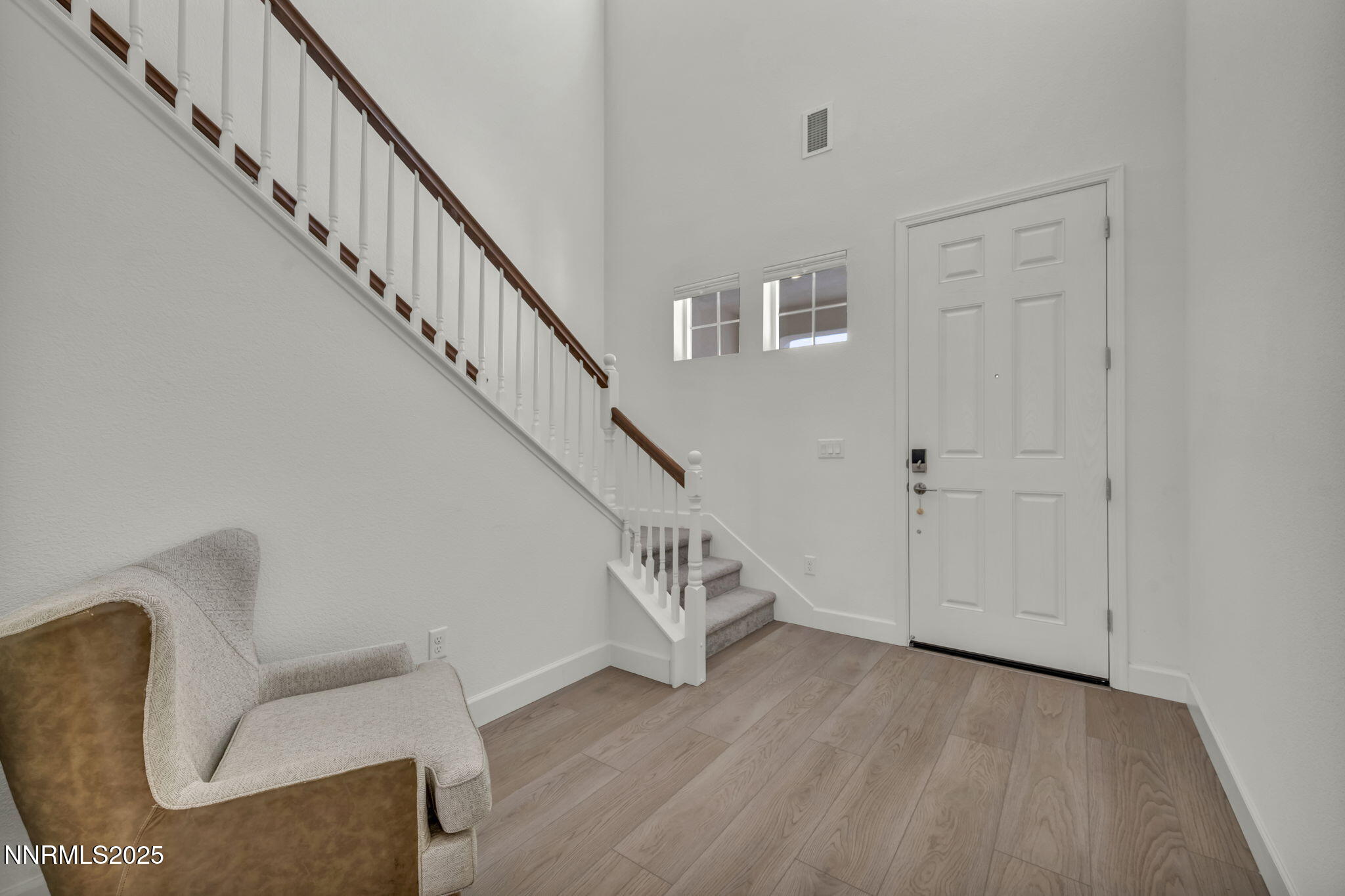 6870 Pilot Peak Road Sparks, NV 89436 - Photo 6 of 55 a view of entryway and hall with wooden floor