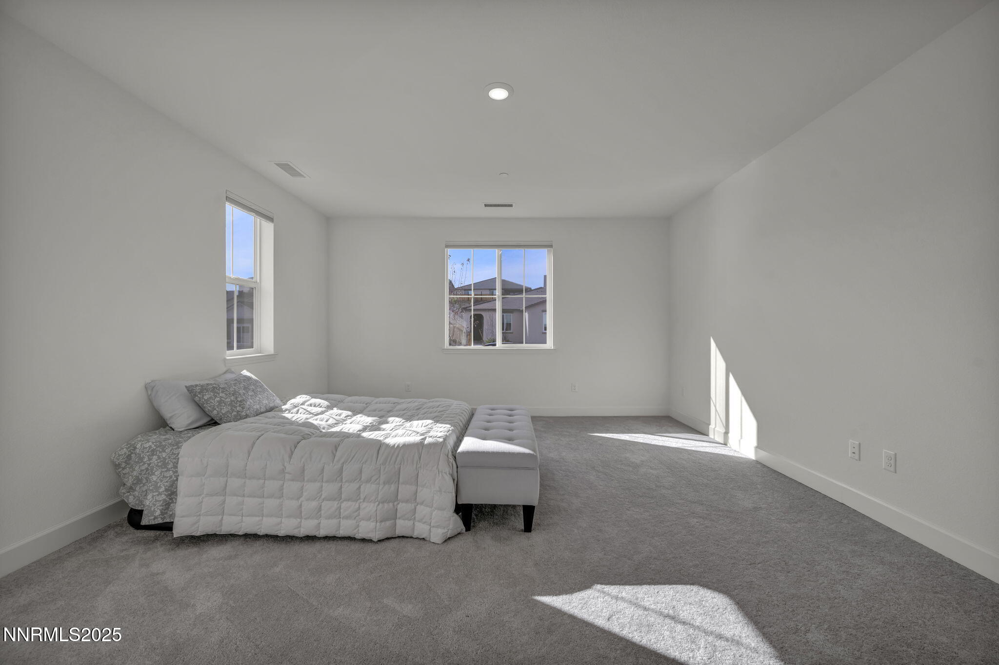 6870 Pilot Peak Road Sparks, NV 89436 - Photo 10 of 55 a bedroom with a bed and window