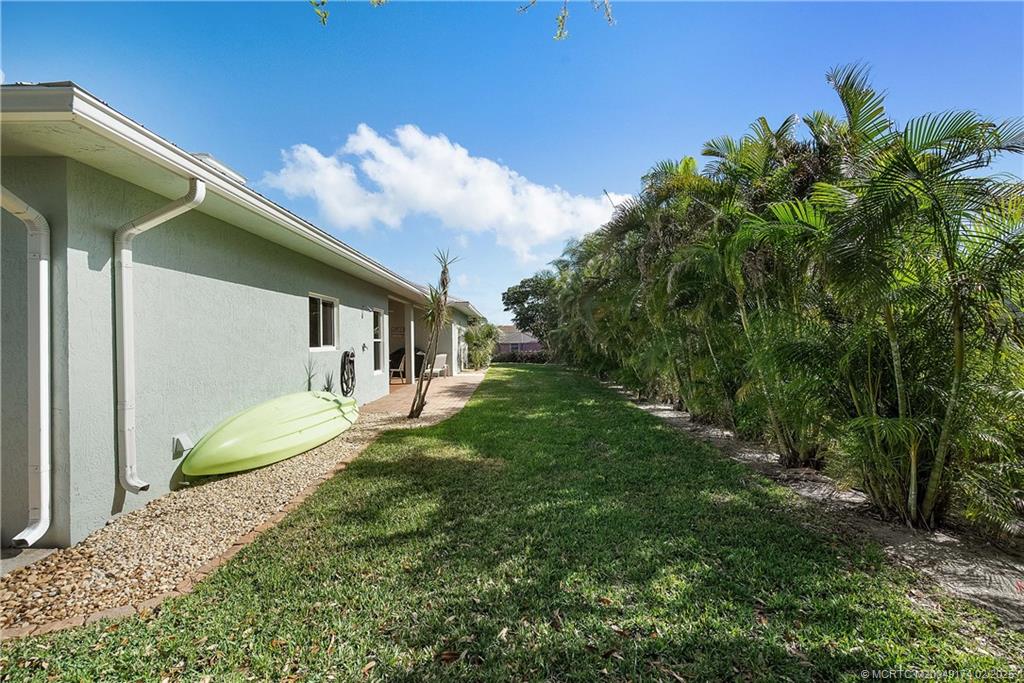 4732 Starling Way Stuart, FL 34997 - Photo 33 of 43 a view of a house with a backyard
