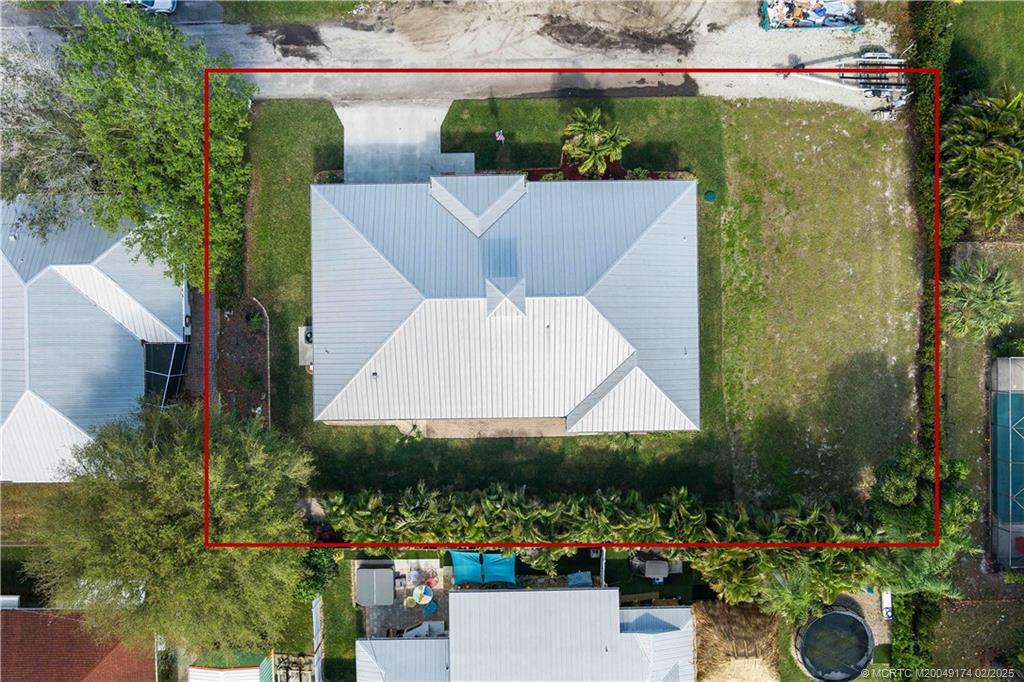 4732 Starling Way Stuart, FL 34997 - Photo 5 of 43 a view of a swimming pool with a patio