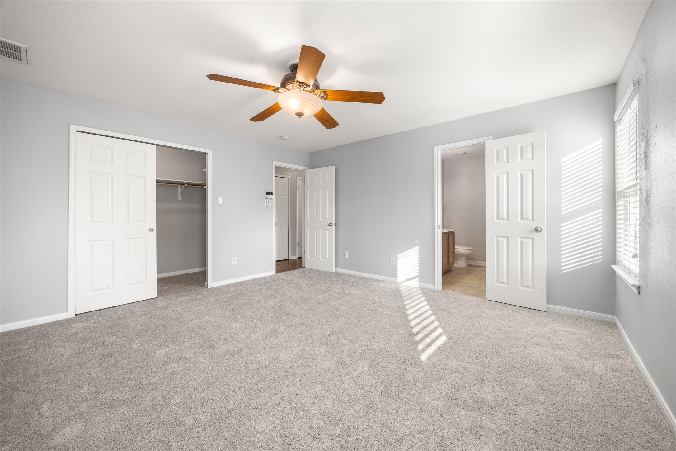 121 Primrose Boulevard Kyle, TX 78640 - Photo 11 of 19 a view of a livingroom with a ceiling fan and window
