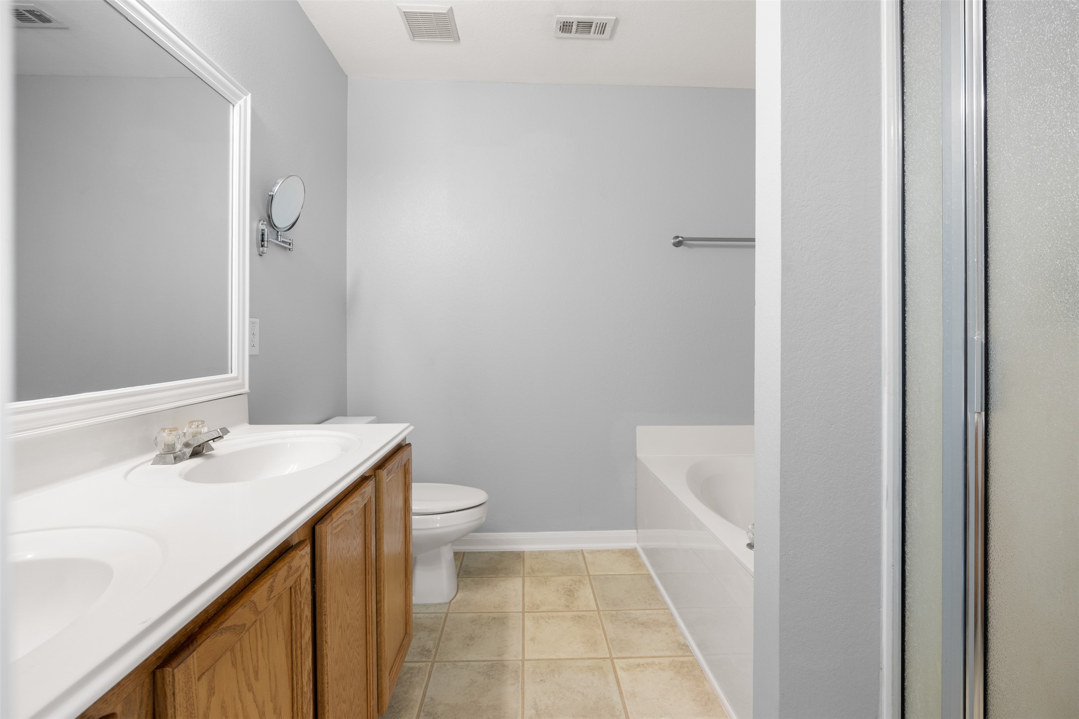 121 Primrose Boulevard Kyle, TX 78640 - Photo 12 of 19 a bathroom with a sink a toilet and shower