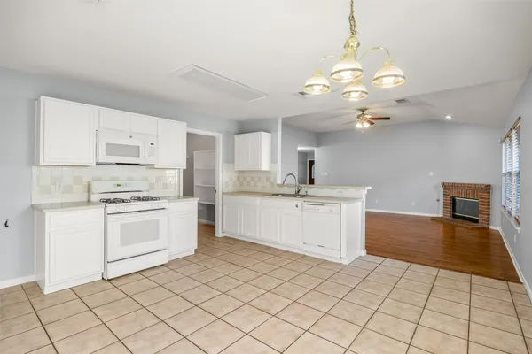 a view of a backyard with swimming pool