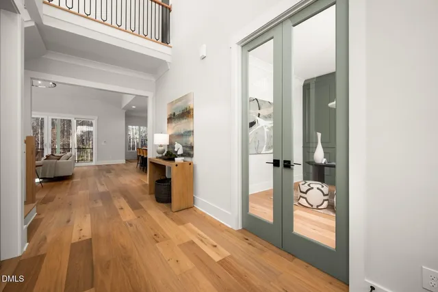 a living room with furniture kitchen view and a table