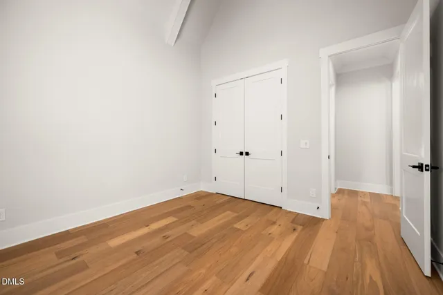a kitchen with stainless steel appliances a refrigerator and a stove top oven