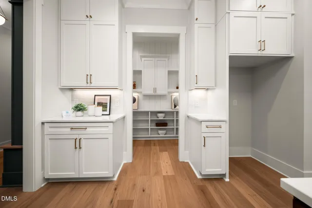 an aerial view of a house with a yard and lake view