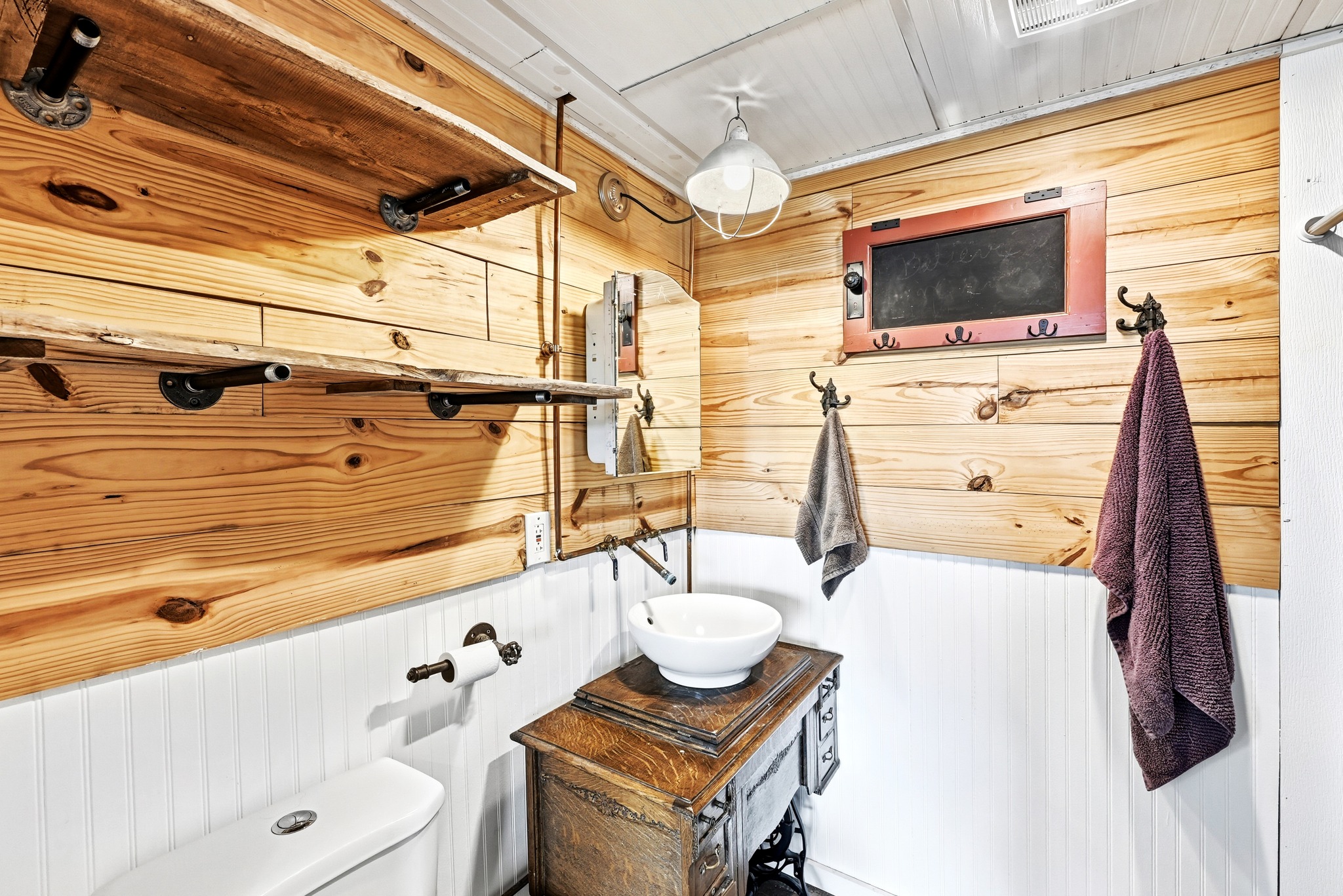 127 KLBJ Road Smithville, TX 78957 - Photo 22 of 39 a bathroom with a sink a mirror and shower
