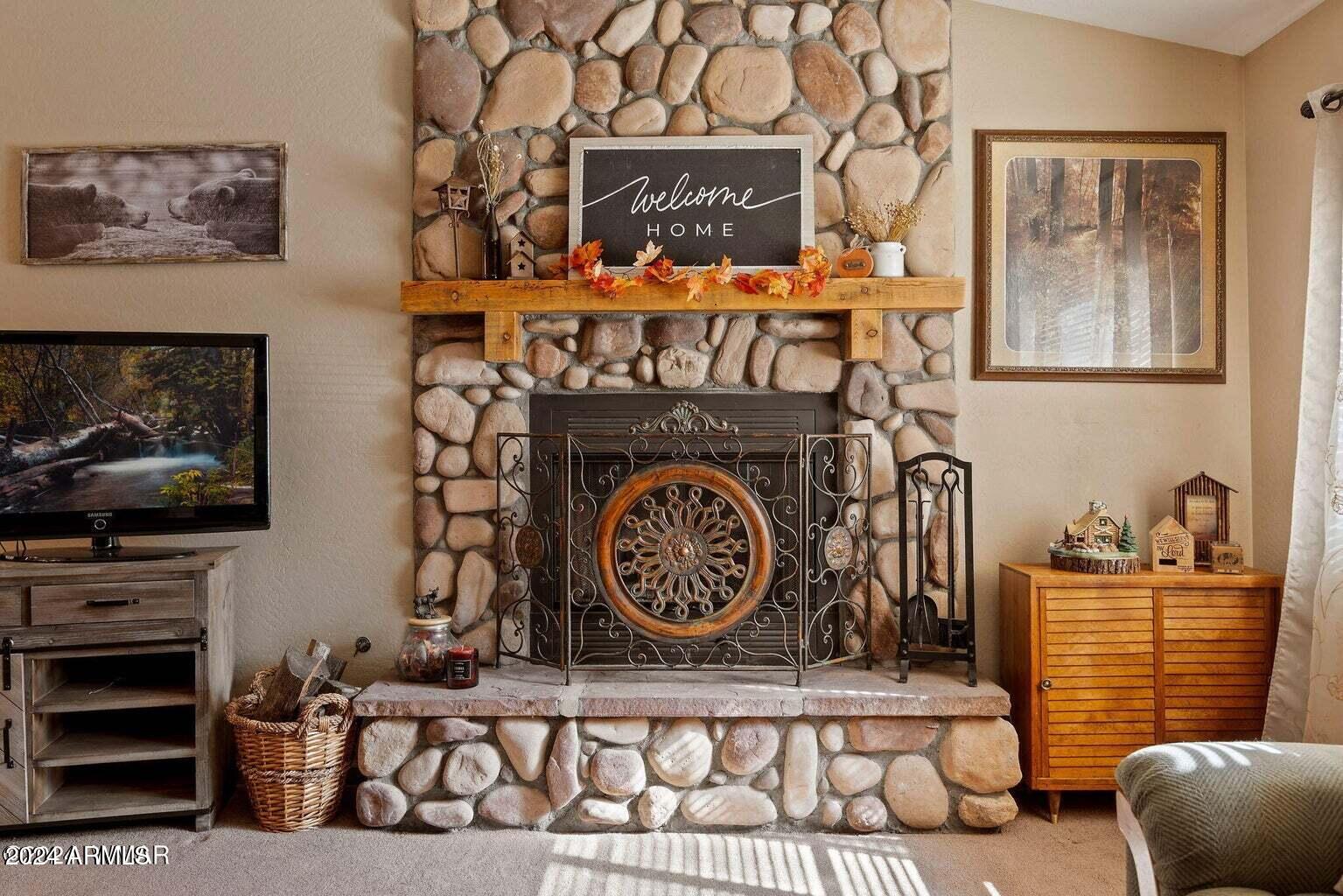 2086 Pinewood Drive Overgaard, AZ 85933 - Photo 15 of 33 a view of fireplace and front door