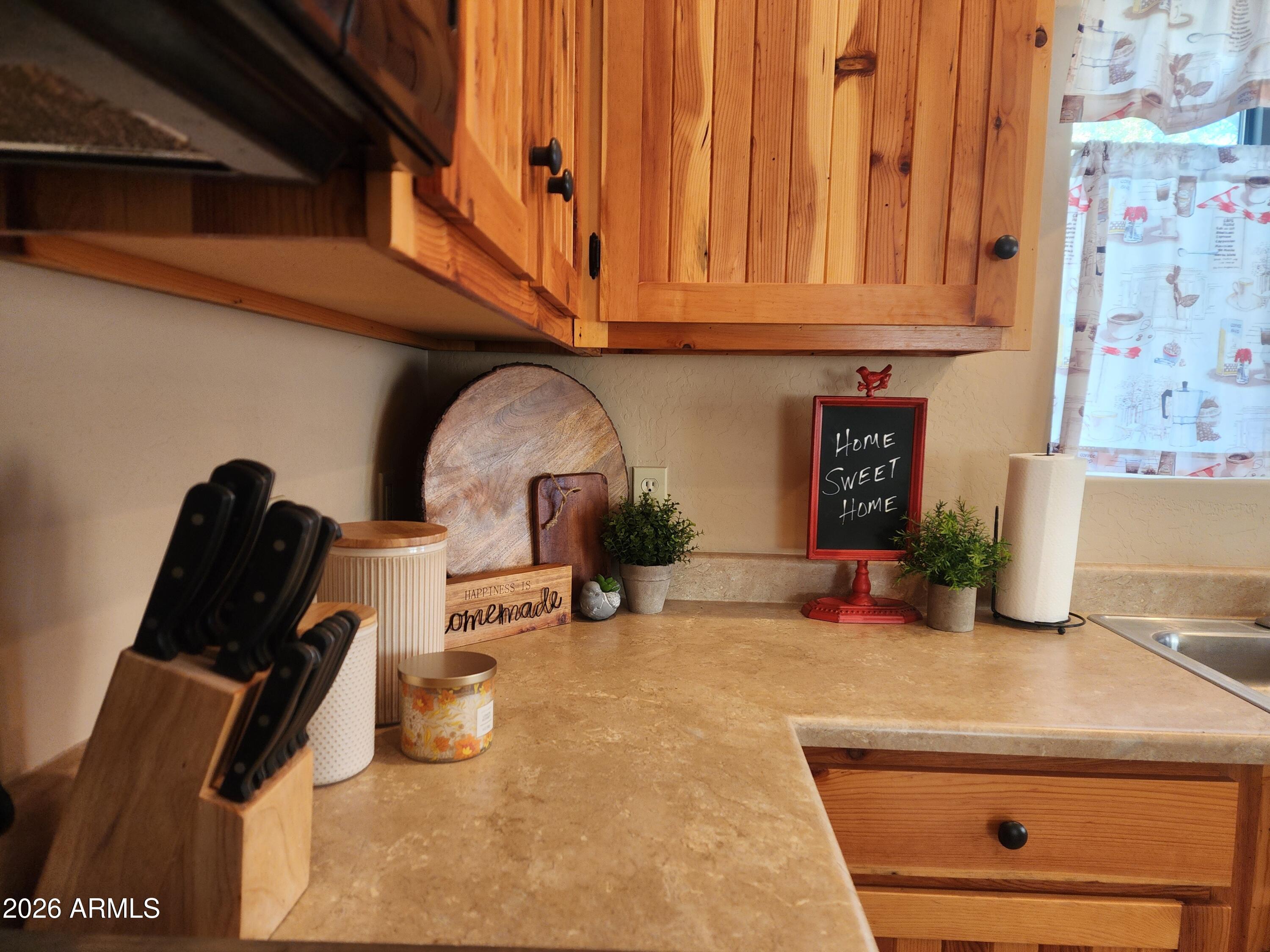 2086 Pinewood Drive Overgaard, AZ 85933 - Photo 21 of 33 a kitchen with a sink and a stove